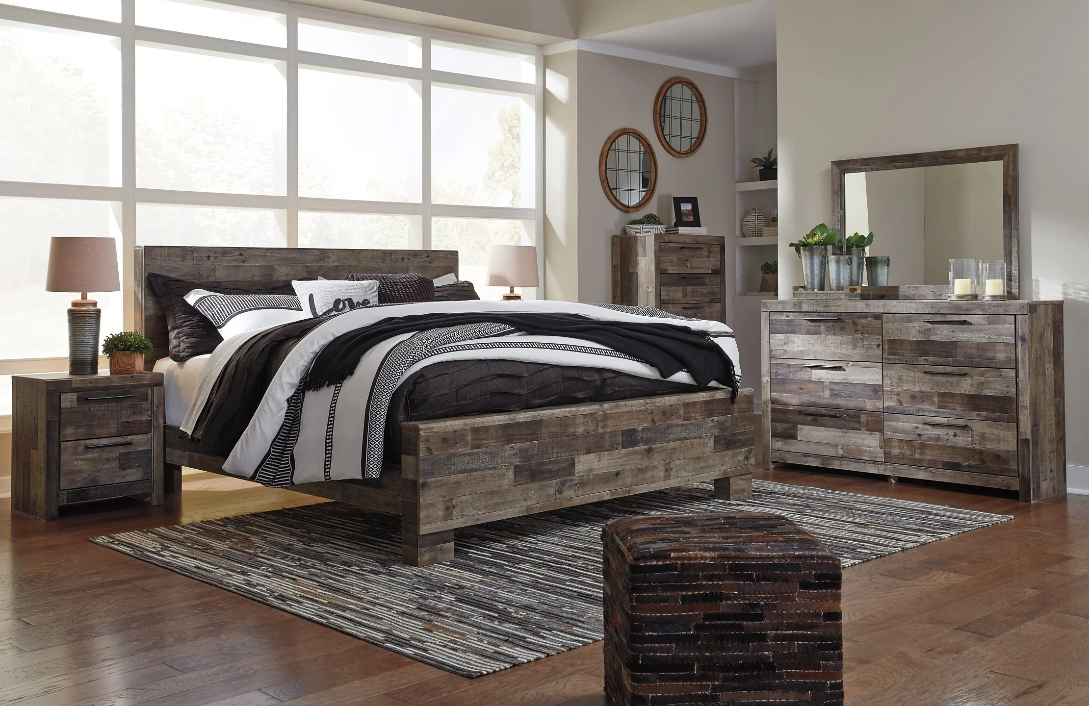 Derekson King Panel Bed with Mirrored Dresser, Chest and Nightstand - Image 11